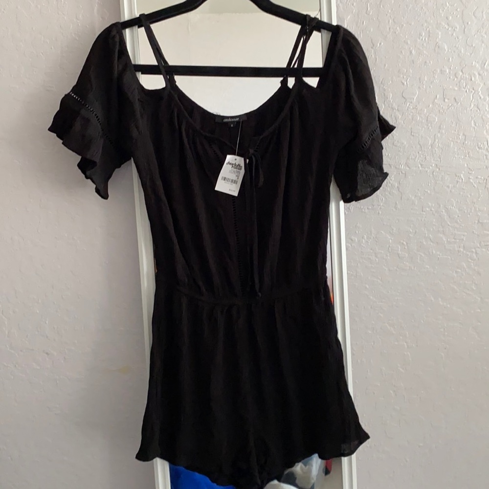Charlotte Russe black cold shoulder romper. Size small.